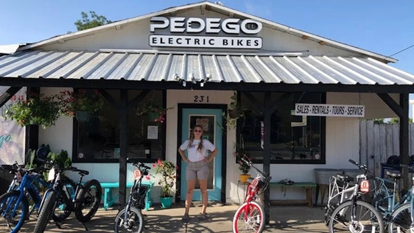 Owner of Pedego New Braunfels, Eliza, standing outside her store.