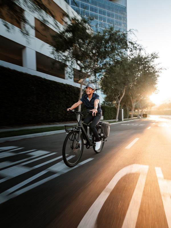 Man enjoying his ridein the city on his Pedego Avenue electric bike