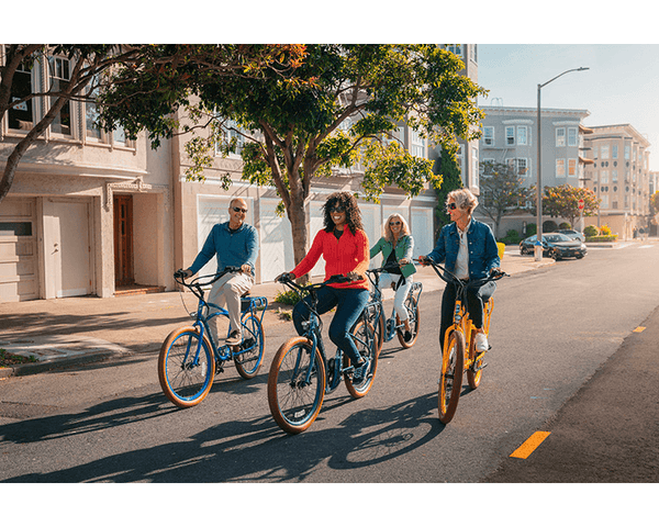 A group of friends enjoying a bike ride on their Pedego Cruiser Electric Bikes|Pedego Interceptor Cruiser Electric Bike|Pedego Interceptor Cruiser Electric Bike|Pedego Comfort Cruiser Electric Bike