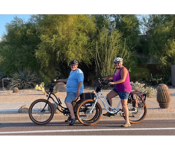Husband and wife riding their Pedego e-bikes in Arizona|