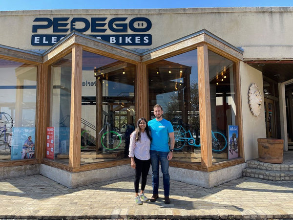 Owners of Pedego San Antonio outside of their storefront.|