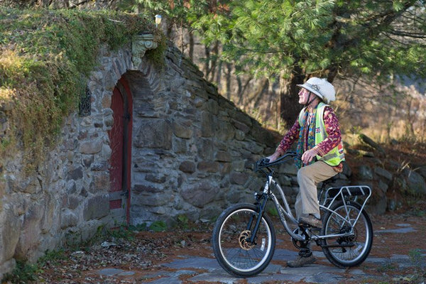 David Hayles looking at ruins on his Pedego Platinum Edition|