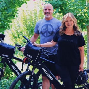 Valerie Bertinelli with her husband posing with their Pedego Electric Bikes