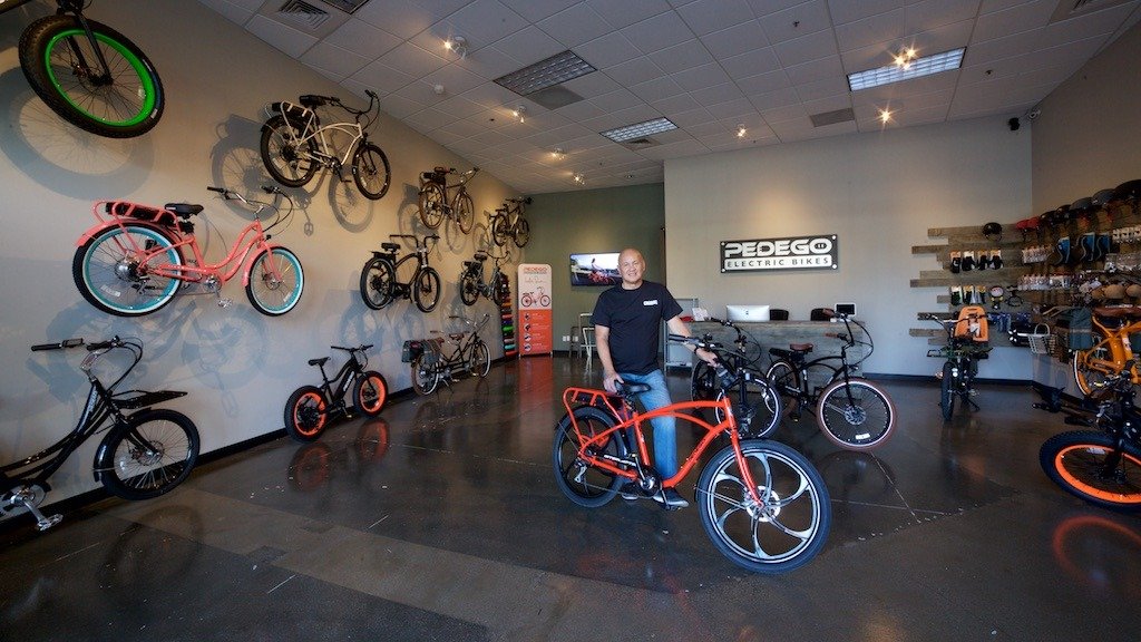 Owner Allan Lat shows off his fleet of Pedego electric bikes