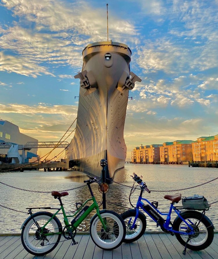 Pedego bikes in front of USS Wisconsin