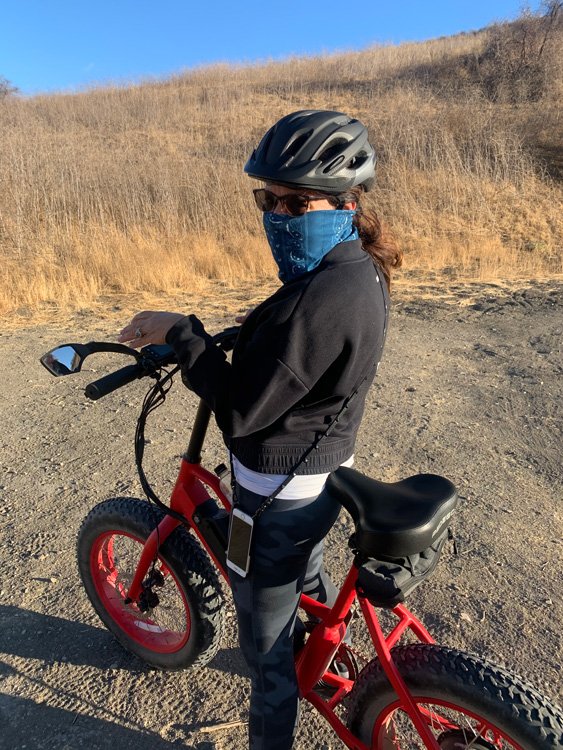 Pedego Customer riding her Element on a trail.