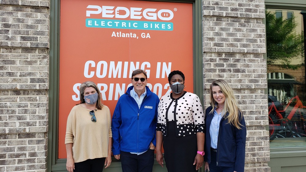 Owner of Pedego Atlanta, Kat, with Don, Cynthia, and City Council President Felicia Moore.