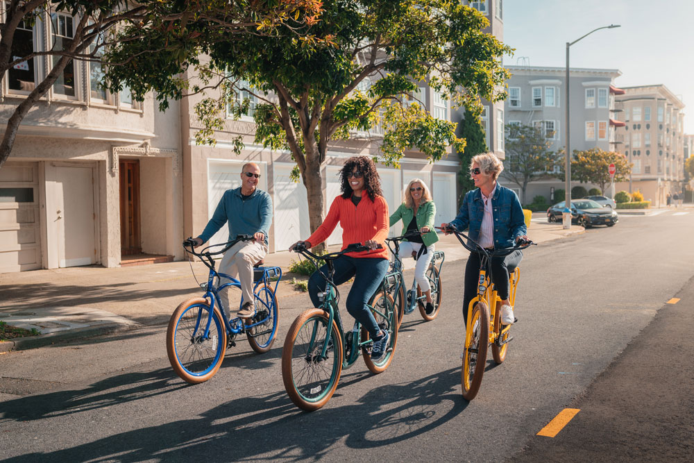 Group of cyclists riding Pedego electric bikes in San Francisco