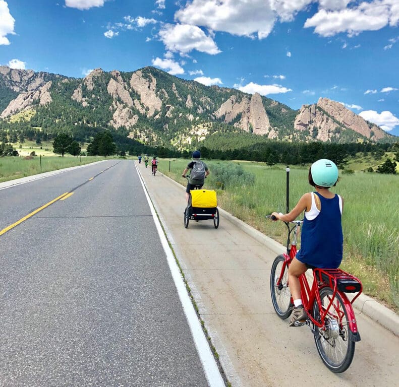 Pedego riders cycling through Boulder, CO.