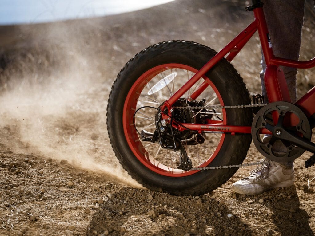 Pedego Element back tire in the dry dirt, showing its durability