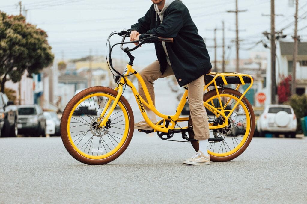Man on a Pedego Interceptor Electric Bike in Yellow.